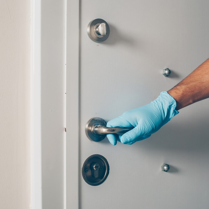 Airborne Locksmith technicians working on a car door