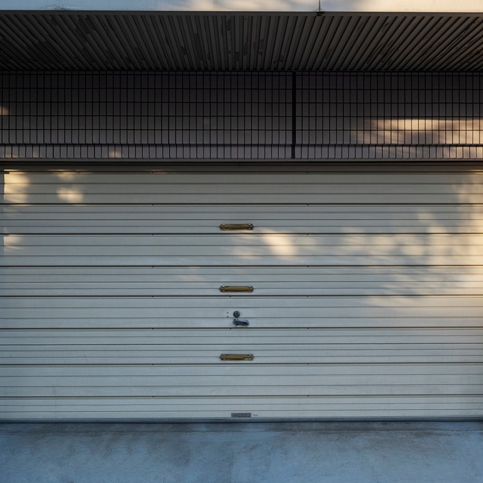 Upgrading an old garage door to a modern design in Charleston.